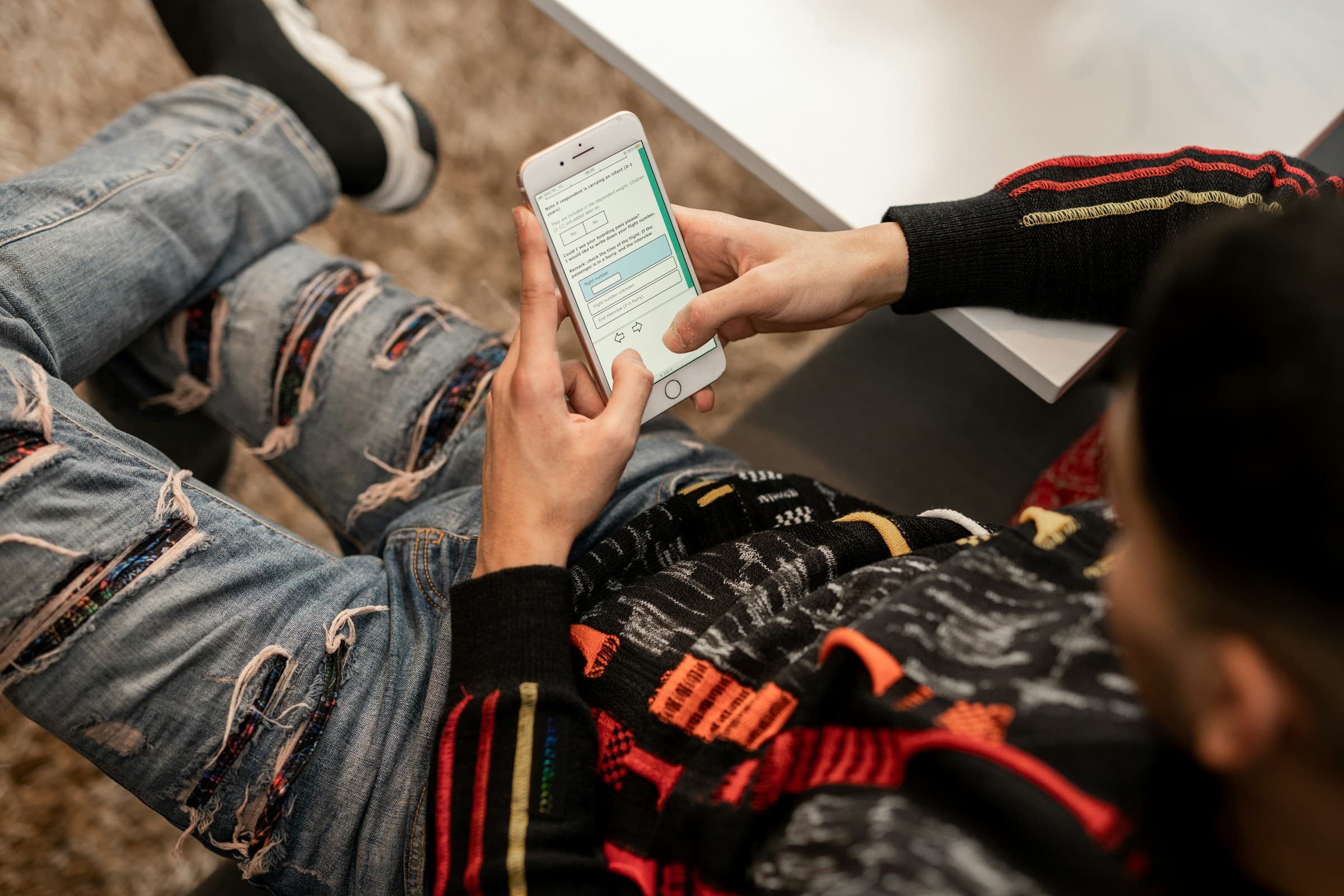 A survey participant answers a questionnaire on a smartphone.