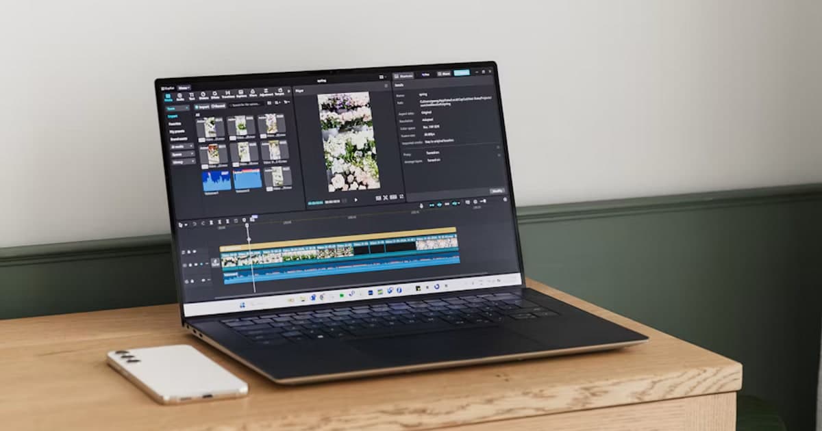 A laptop displays a video project with clip thumbnails and a timeline.