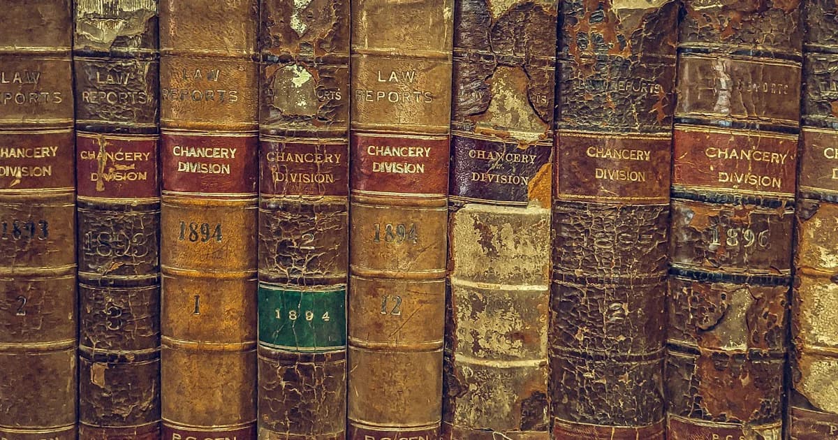 Law books labeled Chancery Division line a library shelf.