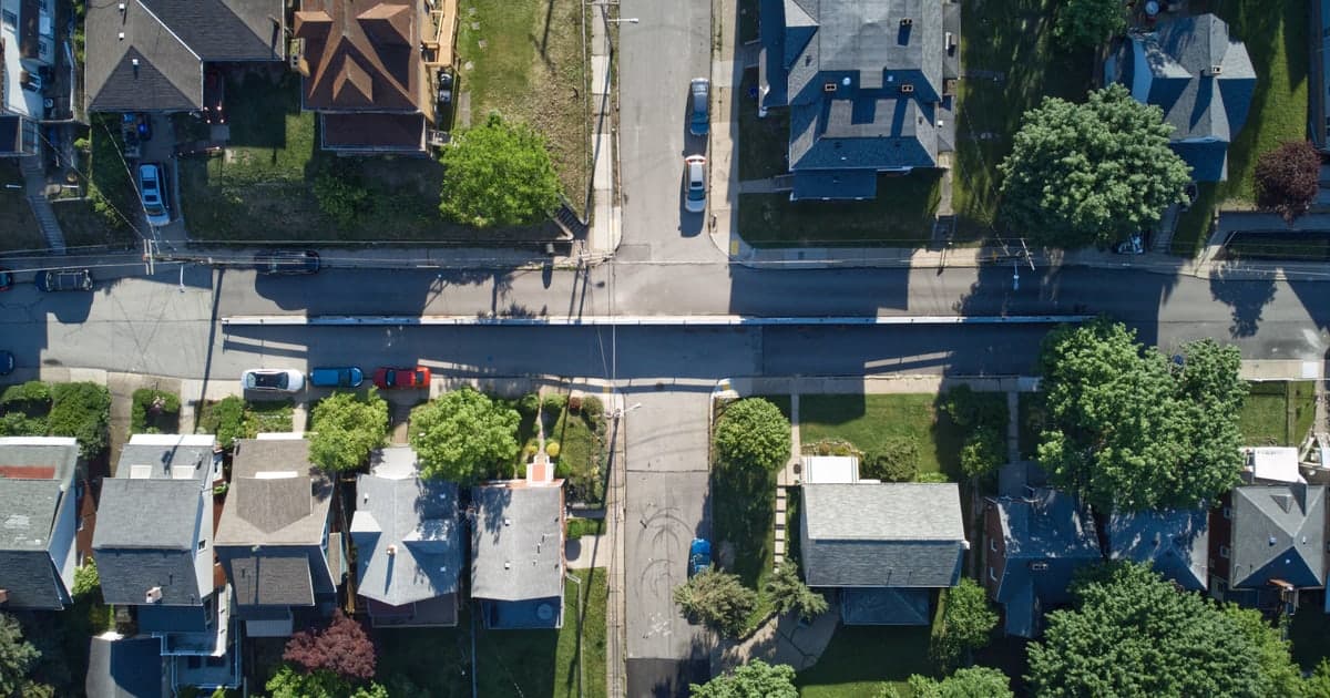 An aerial view of homes, yards, and streets in a Pittsburgh neighborhood.