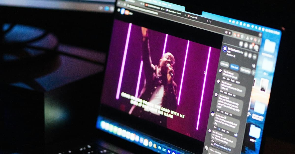 A subtitled live video plays on a laptop screen.